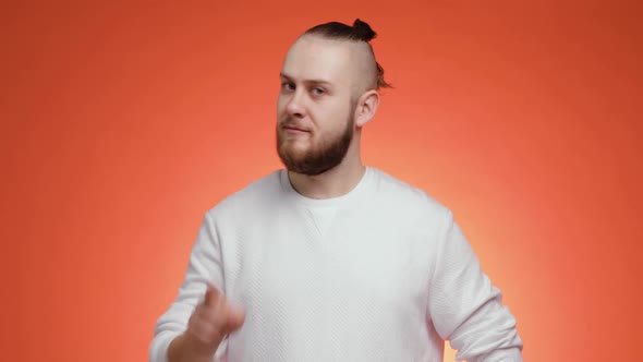 Portrait of Young Man Disapproving with No Finger Sign Making Negation Gesture