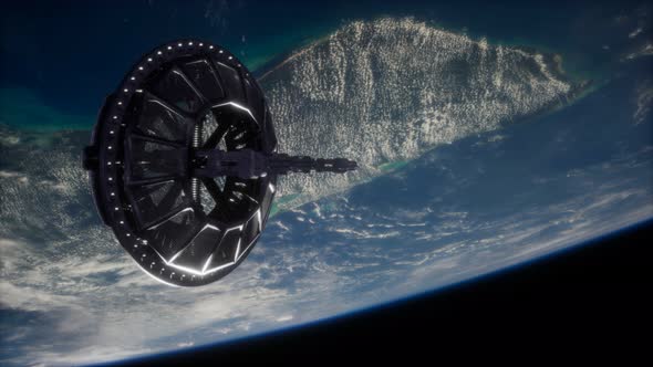 Futuristic Space Satellite Orbiting the Earth alt