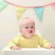 Baby boy sitting in highchair with bunting - VideoHive Item for Sale