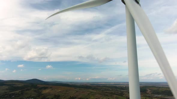 Camera Flight Over Landscape with Power Plant, Aerial View To Wind Turbine, Sustainable Electricity