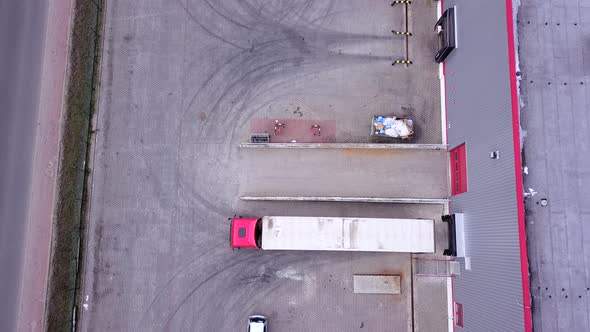 Truck is Driving to Logistics Center. Aerial Shot. Camera is Flying. Aerial Drone