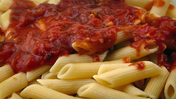 Hot Tomato Sauce Pours On Pasta