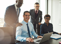 Group of four young business people in office - PhotoDune Item for Sale