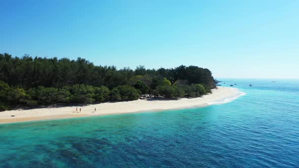 Aerial drone seascape of paradise coast beach break by transparent lagoon with clean sandy backgroun