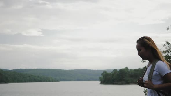 Woman with a backpack walking relax and refresh the air