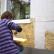 Female Worker Paints the Wooden Wall of the House - VideoHive Item for Sale