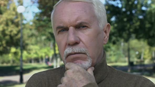 Thoughtful Aged Man With Hands Chin Outdoors, Difficult Choice, Trouble Doubts