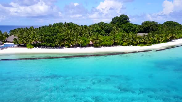 Aerial drone scenery of shore beach voyage by blue sea and sand background