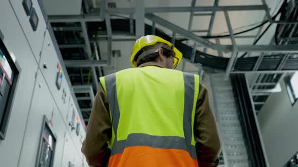 Electrical and Instrument technician checking electrical control board