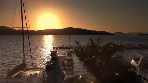 Landscape of the Sunset Over Sea Port with Moored Boats and Yachts Filmed By Drone