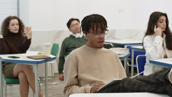 Students Sitting in Classroom on Break