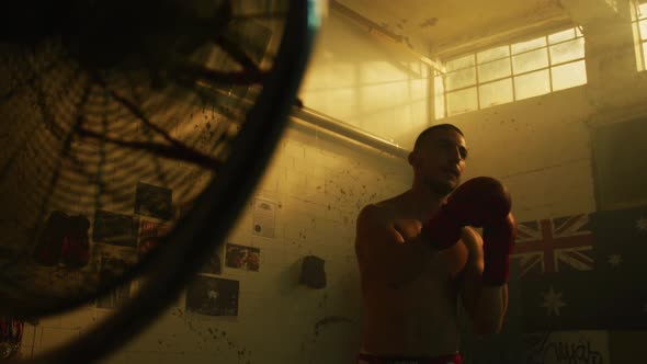 Practicing punches inside a boxing studio