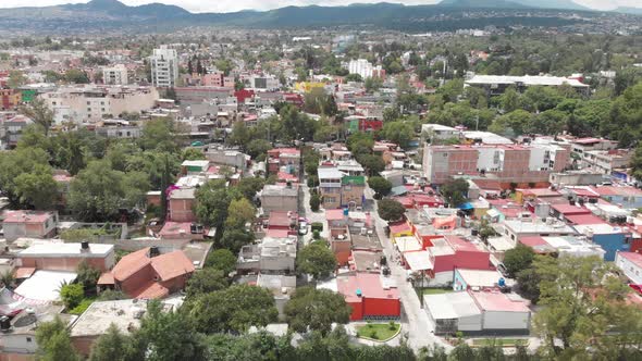 Aerial view of El Manantial neighborhood, in southern Mexico City. Drone flying sideways