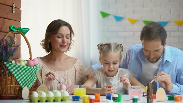 Beautiful Family Decorating Easter Eggs With Colorful Paint, Ancient Traditions
