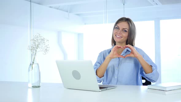 Heart Sign by Woman in Office, Hands Gesture