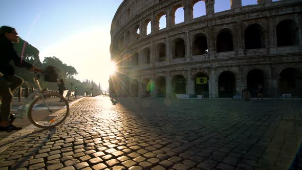 Crowded street front of Colosseum in Rome, Italy