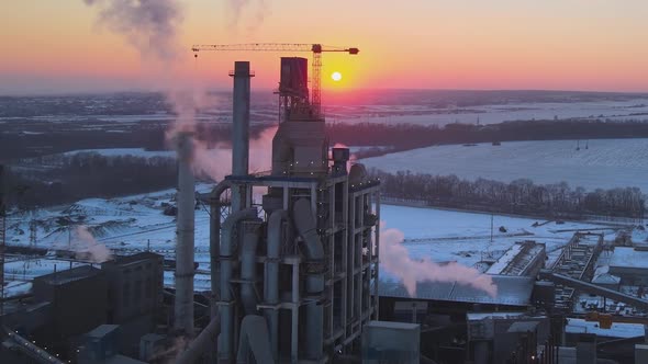 Aerial View of Cement Factory Tower with High Concrete Plant Structure at Industrial Production Area