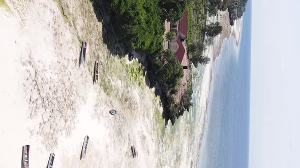 Vertical Video of Low Tide in the Ocean Near the Coast of Zanzibar Tanzania Aerial View