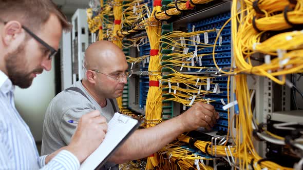 Engineers Working in Data Room