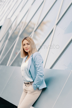 young female executive in an urban setting near office building