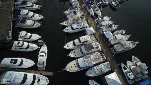 Expensive boats and yachts docked at Seattle's South Lake Union dock.