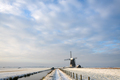 Winter landscape with a windmill under a nice sky - PhotoDune Item for Sale