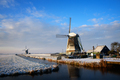 Windmills in the snow in a winter landscape at sunrise - PhotoDune Item for Sale