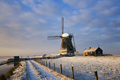 Path towards a windmill in the snow in a dutch winter landscape - PhotoDune Item for Sale