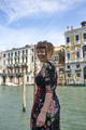 Caucasian redhead woman with floral dress looking at grand canal Venice smiling - PhotoDune Item for Sale