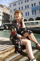 Caucasian redhead woman with floral dress looking at grand canal Venice - PhotoDune Item for Sale