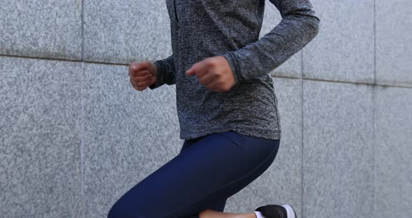 Fitness sports woman running up stairs in city