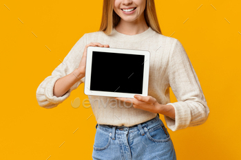 nk screen on orange background, copy space
