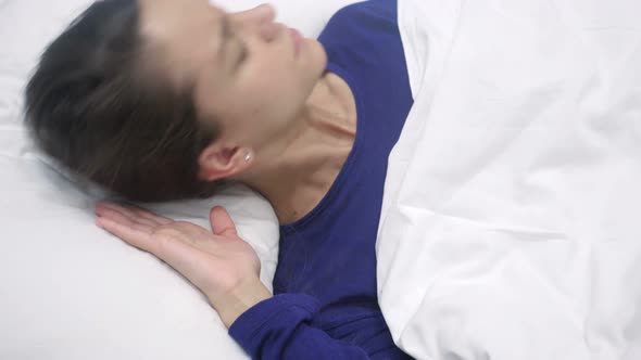 Sleeping Latino Woman with Headache