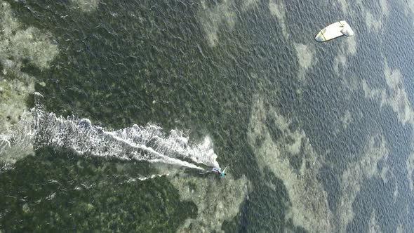 Vertical Video Kitesurfing Near the Shore of Zanzibar Tanzania Aerial View