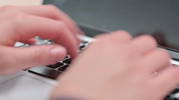 Close Up of Female Fingers Typing on Laptop