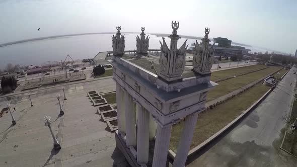 Flying over the aged columns on city waterfront Volgograd, Russia