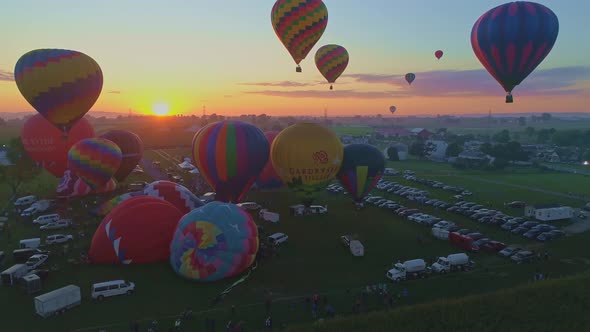 Aerial View of a Morning Launch of Hot Air Balloons at a Hot Air Balloon Festival at Sunrise