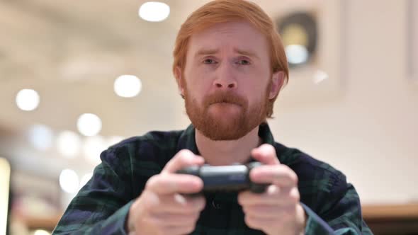 Beard Redhead Man Playing Video Game