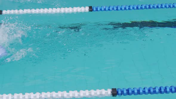 Swimmer swimming into the pool