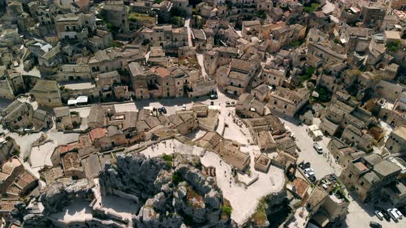 Aerial View of Narrow Streets of Ancient City of Matera Above Roofs of Houses