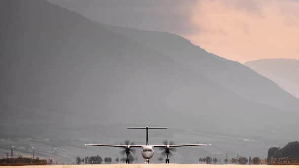 Propellor Airplane Taxiing On Runway