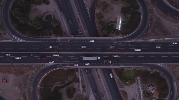 Fast camera for intersection of roads, bridges, cars, trucks, bus, view from the air with drone