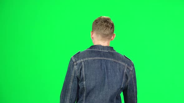 Back View of Man Walking and Greeting on a Green Screen, Chroma Key