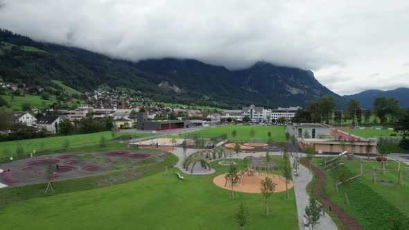 Playground for Children in Liechtenstein Among the Mountain Valley Aerial Vew