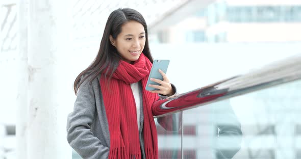 Woman use of smart phone in city