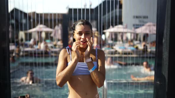 Beautiful Girl In Swimwear Showering Under Water At Resort Beach