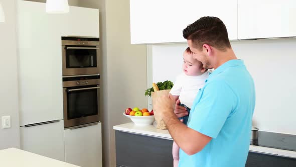 Working Mother Waving Goodbye to House Husband and Baby