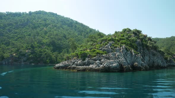 Coastline of a beautiful green island in the open sea