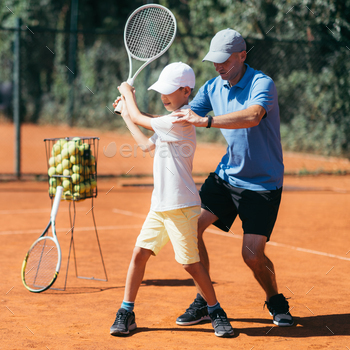  Boy having a Tennis Lesson.