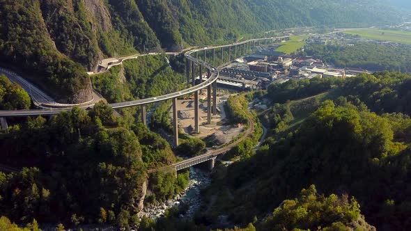 Aerial view of a huge and busy viaduct in the mountains. Viaduc des Égratz de Passy, french Alps.